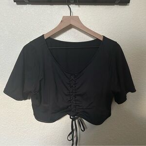 Good American lace up short sleeved swim top